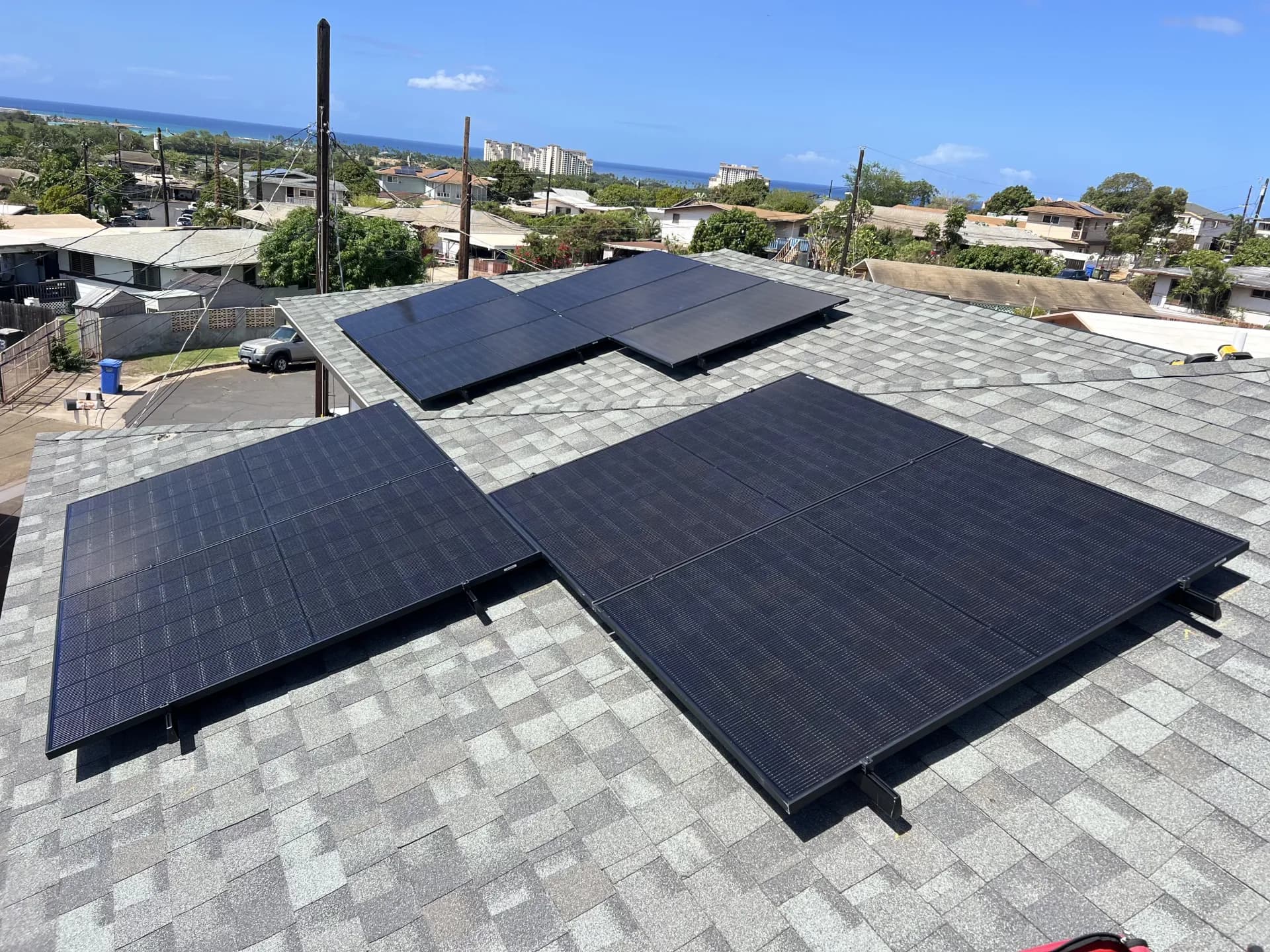 Rooftop solar panel array with ocean views in Honolulu