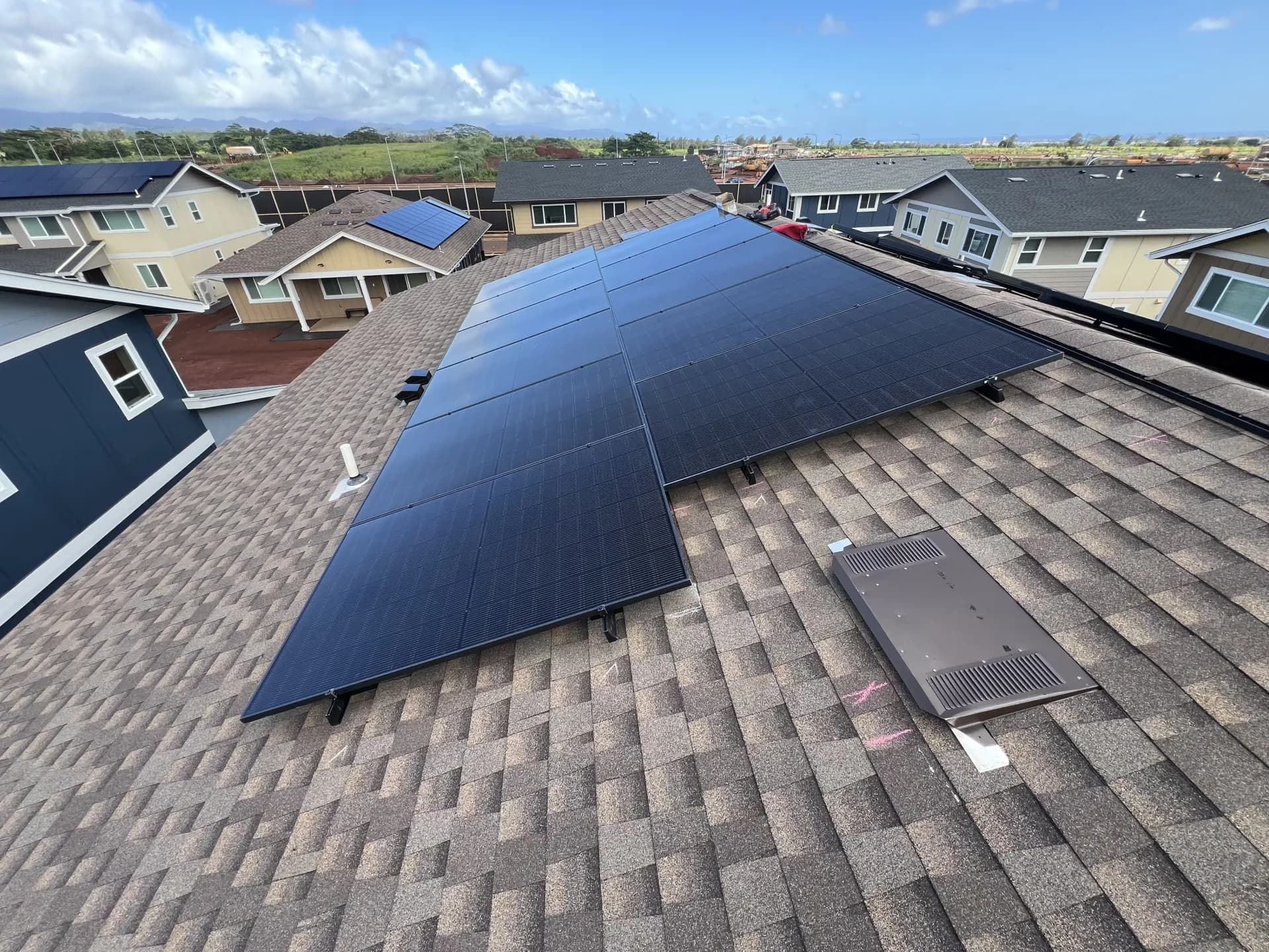 Large residential solar installation across neighborhood rooftops